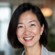 Portrait of Dr. Sarah Chen, a smiling functional medicine practitioner.